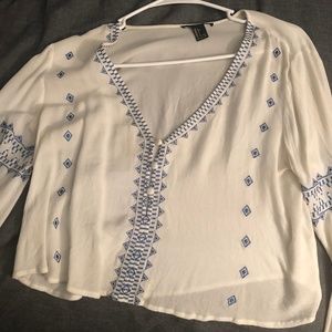Bell bottom sleeved embroidered top